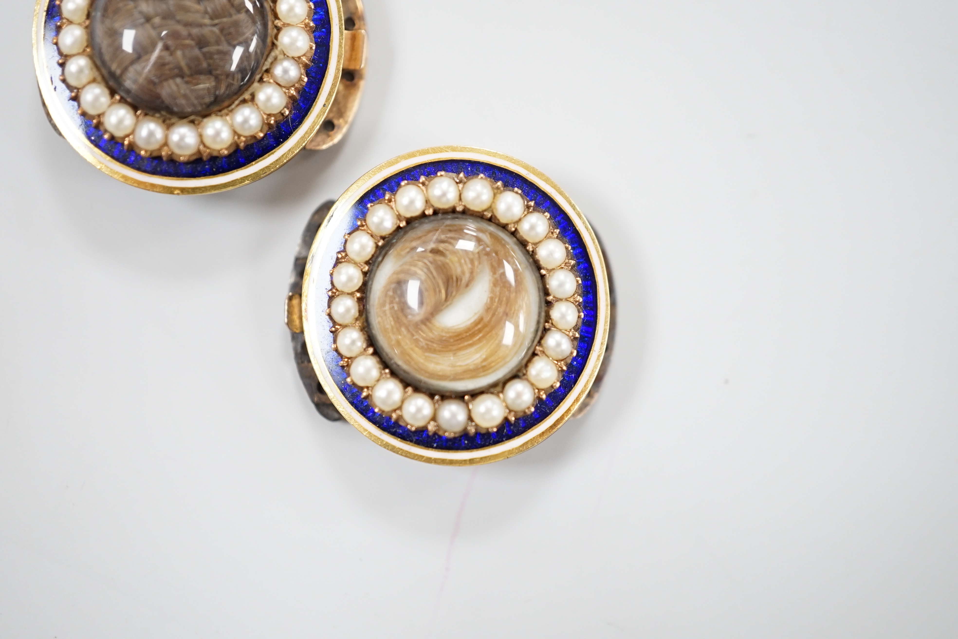 A pair of George III gold, enamel and pearl set clasps, each with differing hairwork inset and differing monogram / initials to the back, 2.25cm
